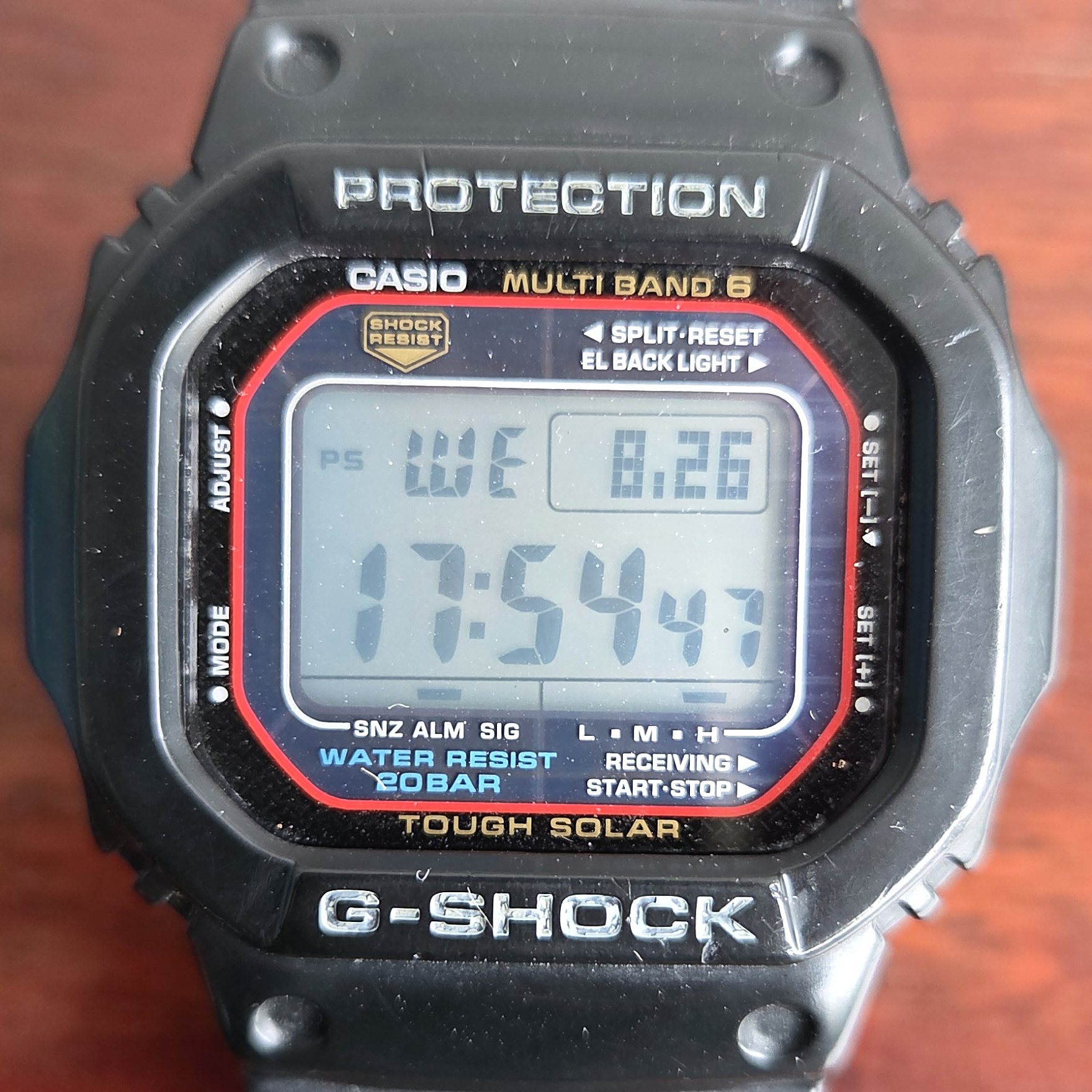 The square G-Shock face on, with the red accents around the display.