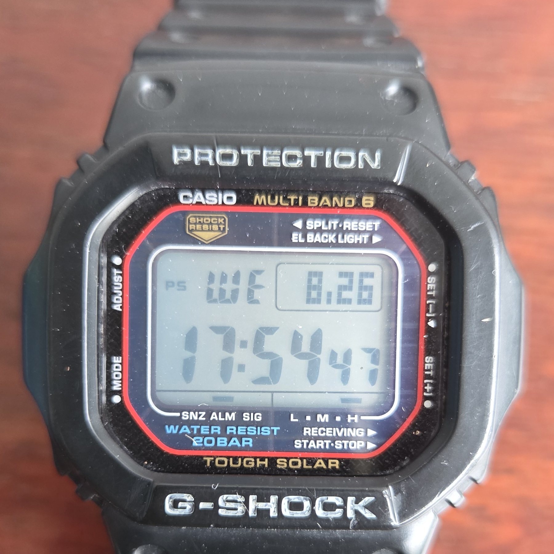 The square G-Shock face on, with the red accents around the display.