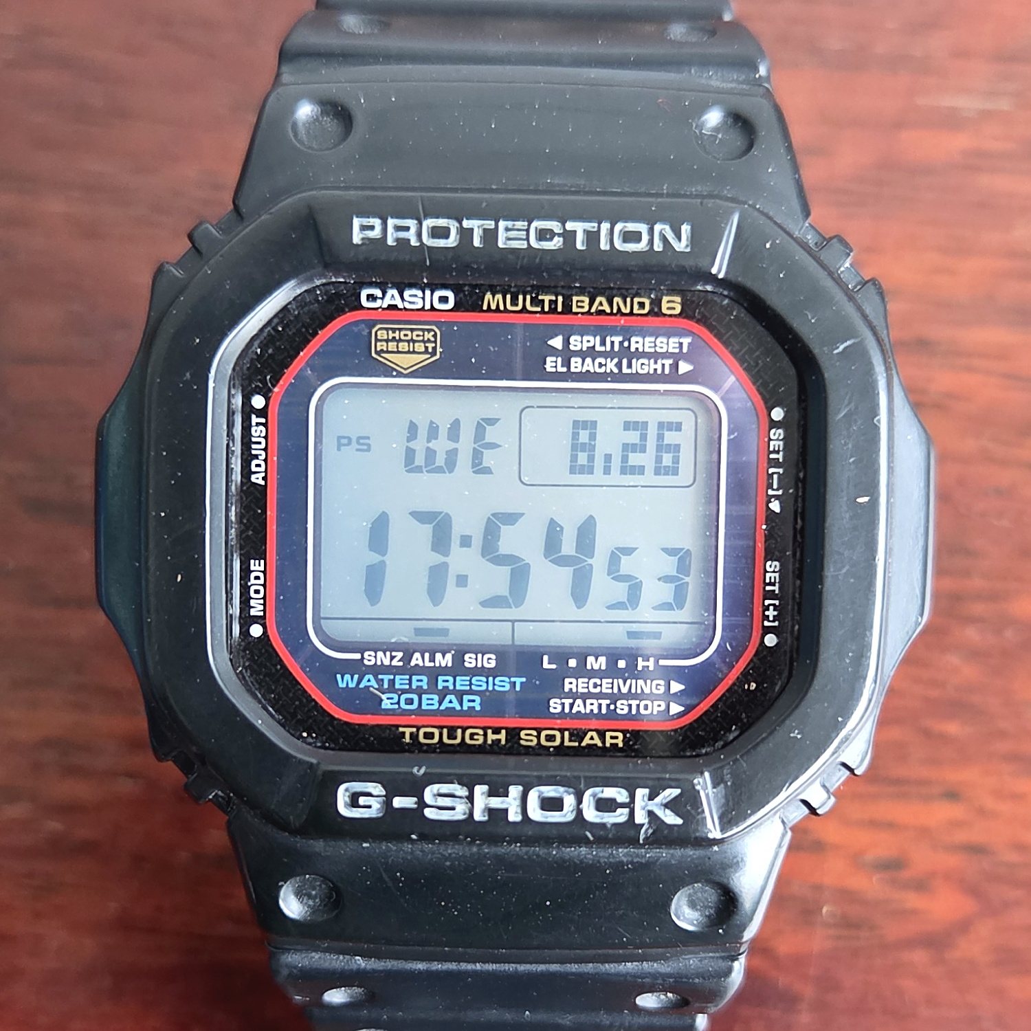 A black resin Casio G-Shock square, its negative LCD showing the time, with MULTI BAND 6 and TOUGH SOLAR printed on the dial.