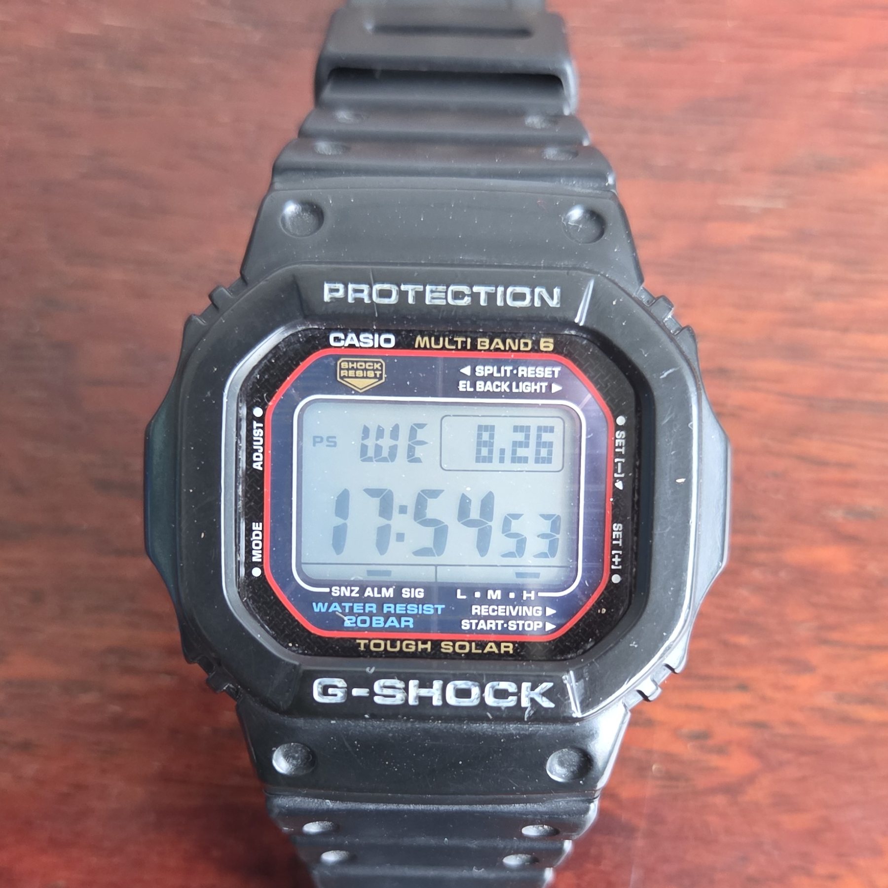 A black resin Casio G-Shock square, its negative LCD showing the time, with MULTI BAND 6 and TOUGH SOLAR printed on the dial.