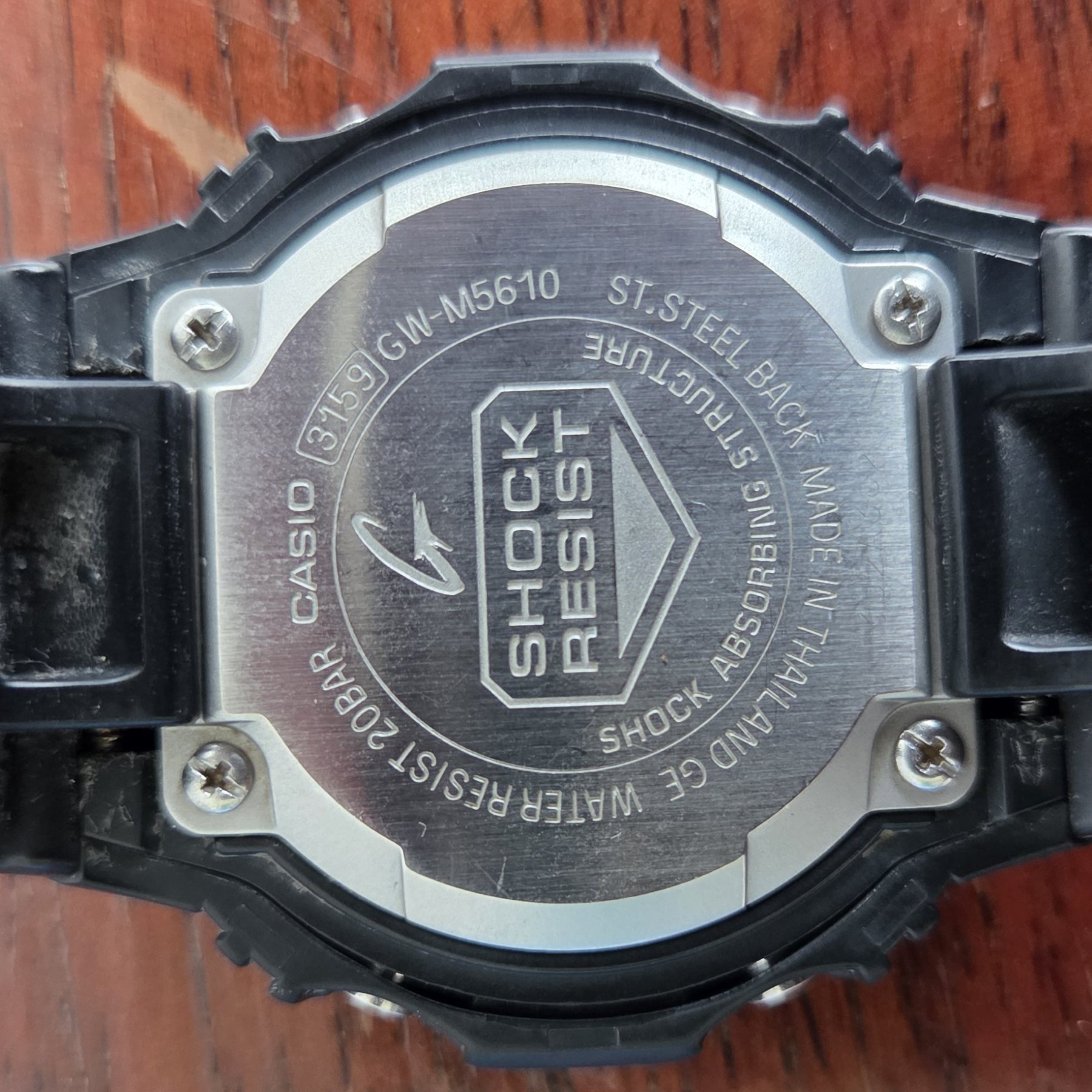 The stainless steel case back, stamped CASIO 3159 GW-M5610 and SHOCK RESIST.