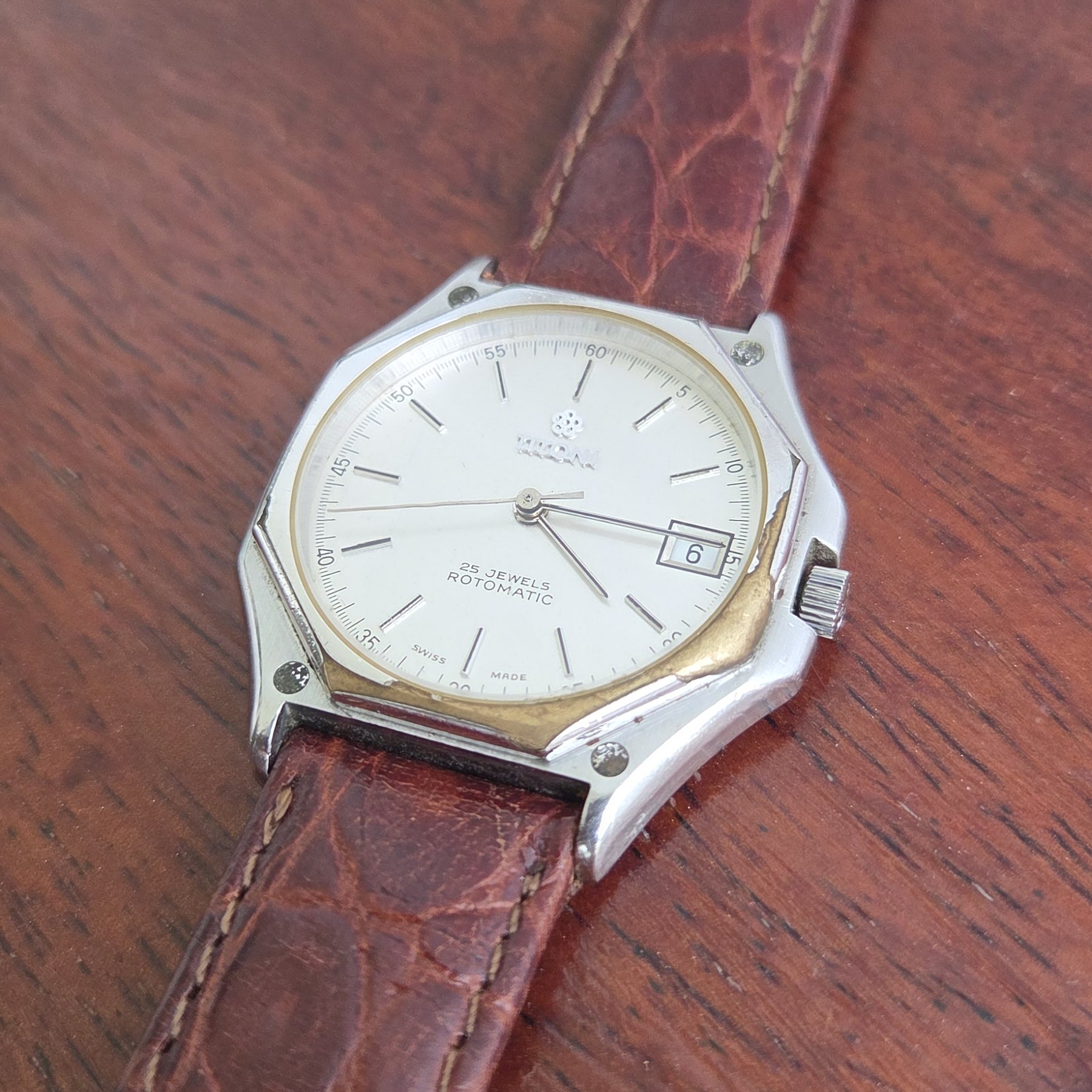 The dial at an angle, the date window clearly visible.