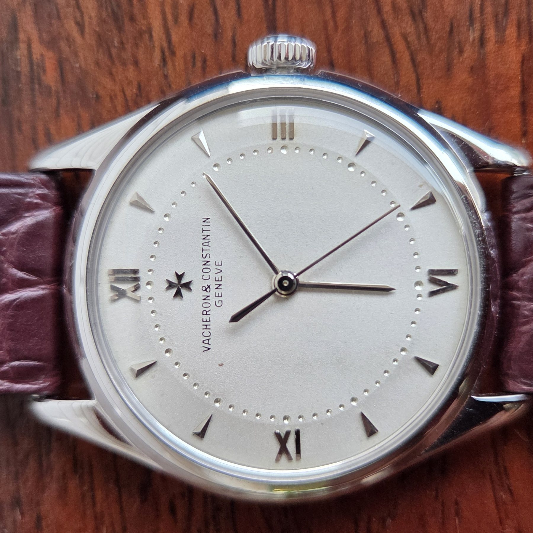 Close view of the dial showing the applied Maltese cross above the Vacheron & Constantin Genève signature.