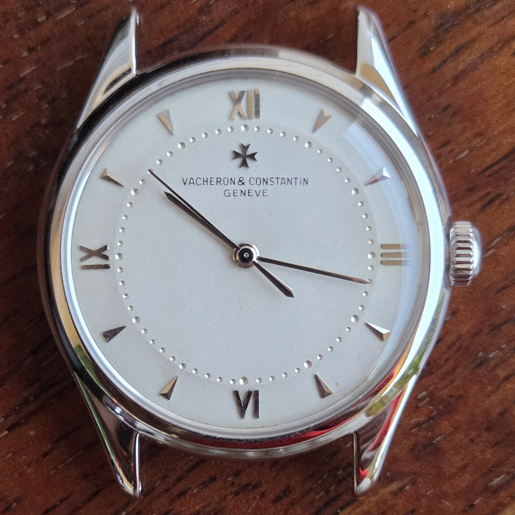 The Vacheron Constantin 4465 square-on, off its strap, showing the whole silvered dial and the shaped lugs.