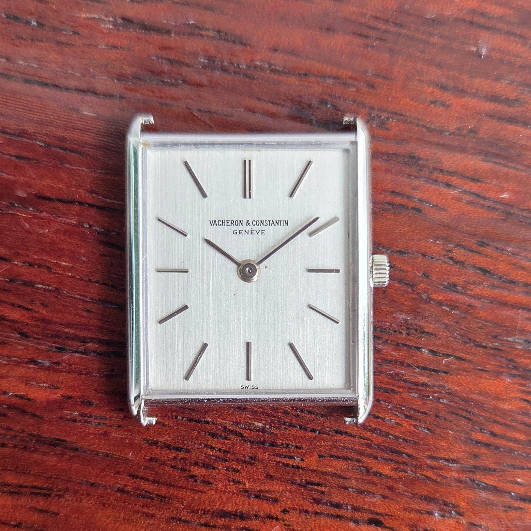 The same dial from slightly above, showing the brushed finish catching the light.
